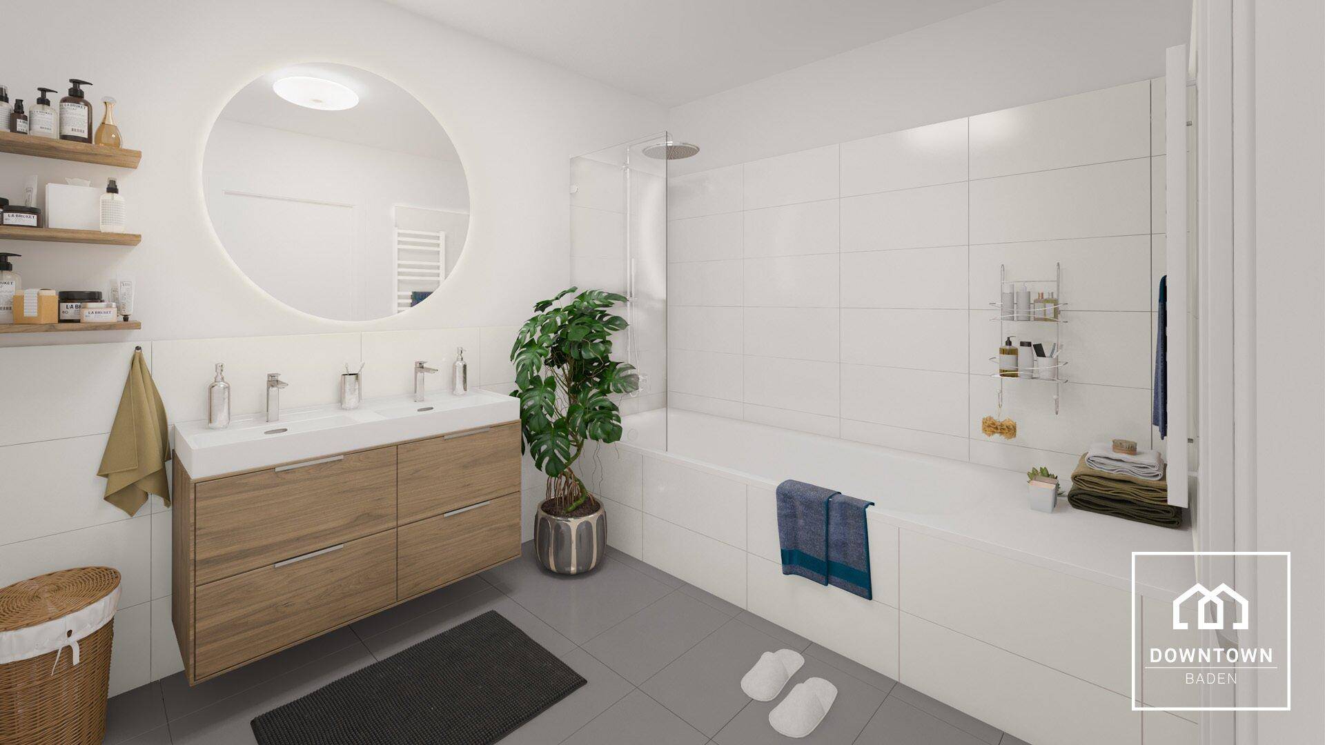 Modernes Badezimmer mit Doppelwaschbecken, Badewanne mit Duschbereich und grauen Fliesen.