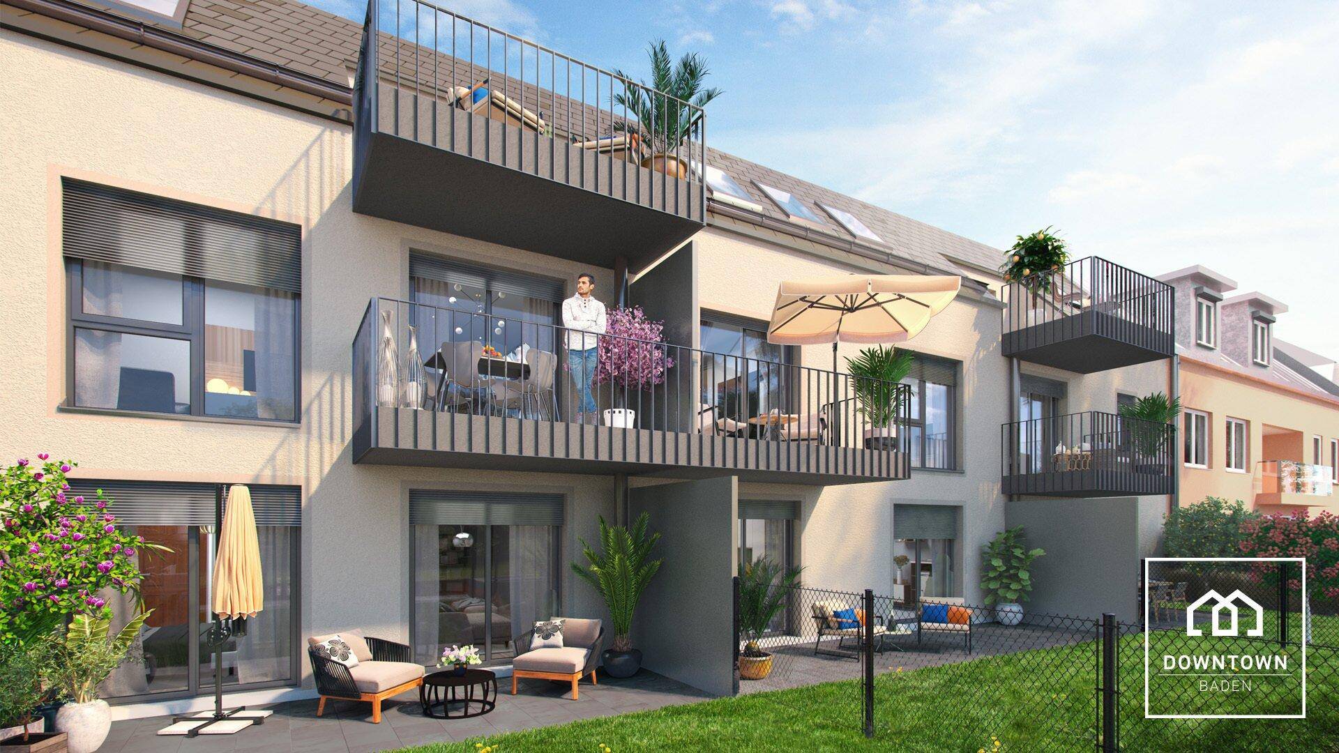 Moderne Wohnanlage mit mehreren Balkonen, Terrassen und einem gepflegten Rasenbereich.