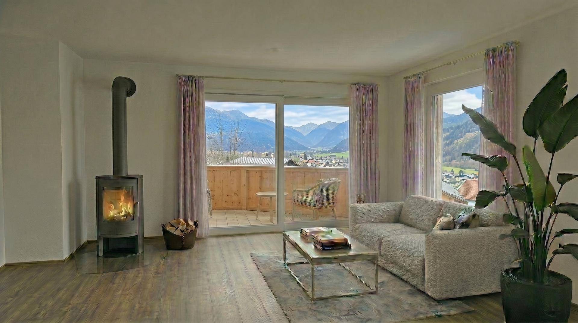Helles Wohnzimmer mit gemütlichem Kaminofen, Holzboden und Zugang zum Balkon mit Bergblick.