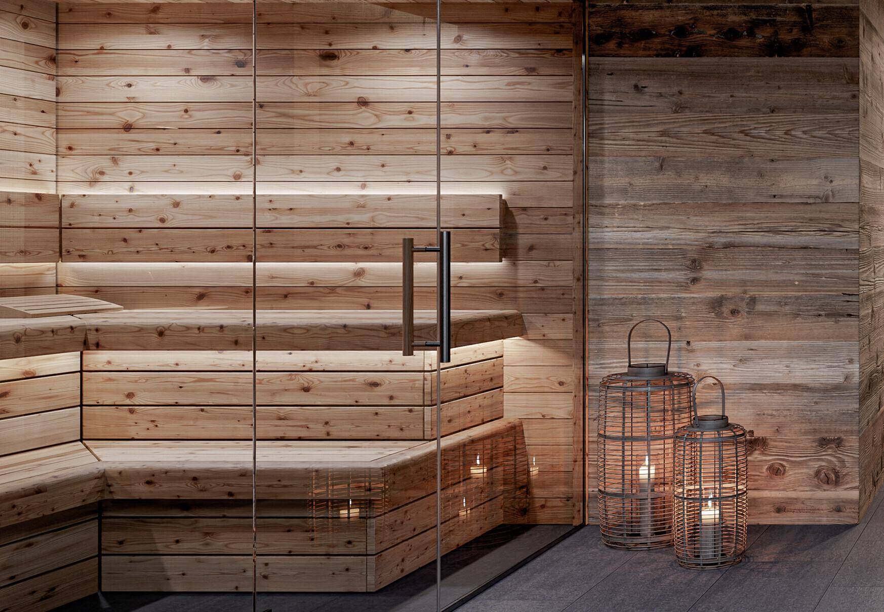 Detailansicht einer modernen Holzsauna mit Glastür und indirekter Beleuchtung im Wellnessbereich.