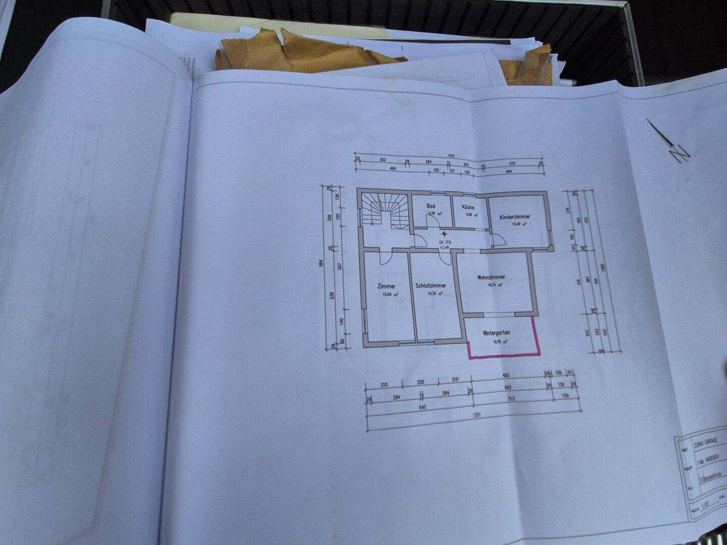 Detaillierter Grundrissplan mit Zimmern, Küche, Bad und Wintergarten.