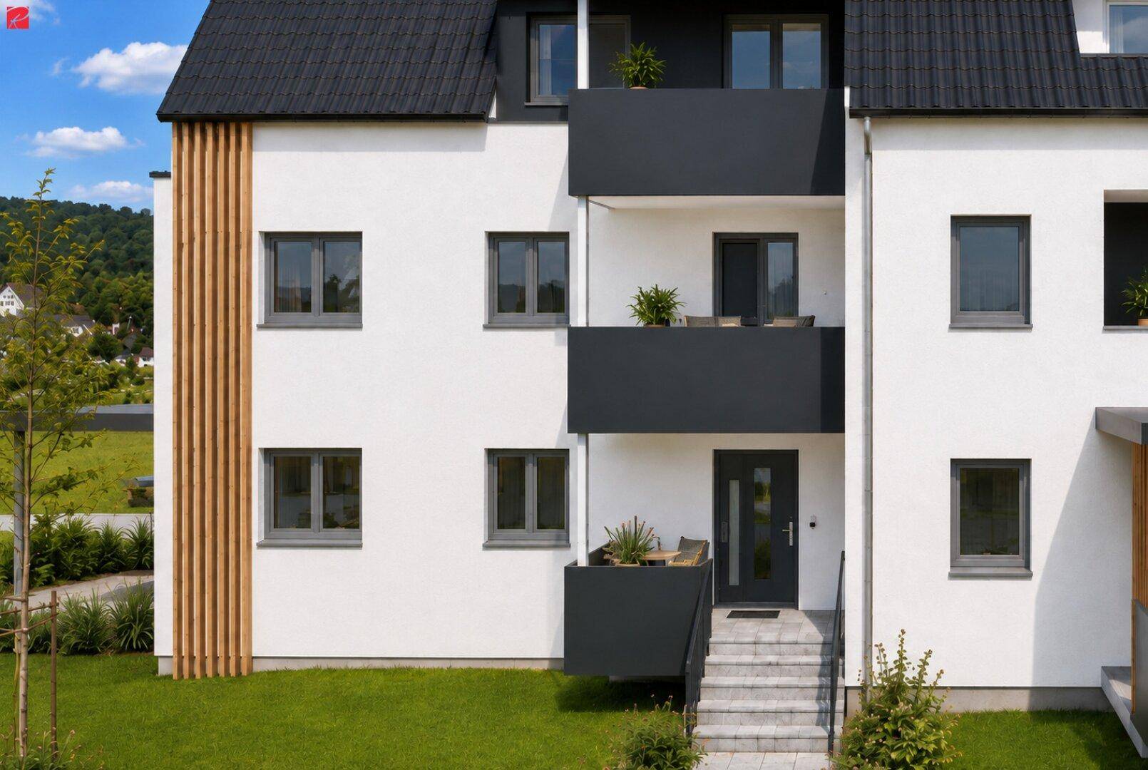 Detailansicht der modernen Gebäudefassade mit Eingangsbereich und dunklen Balkonen.