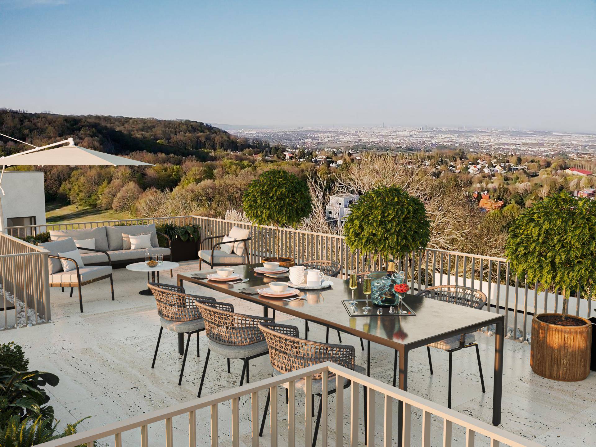 Geräumige Dachterrasse mit Ess- und Loungebereich und weitem Stadtblick.