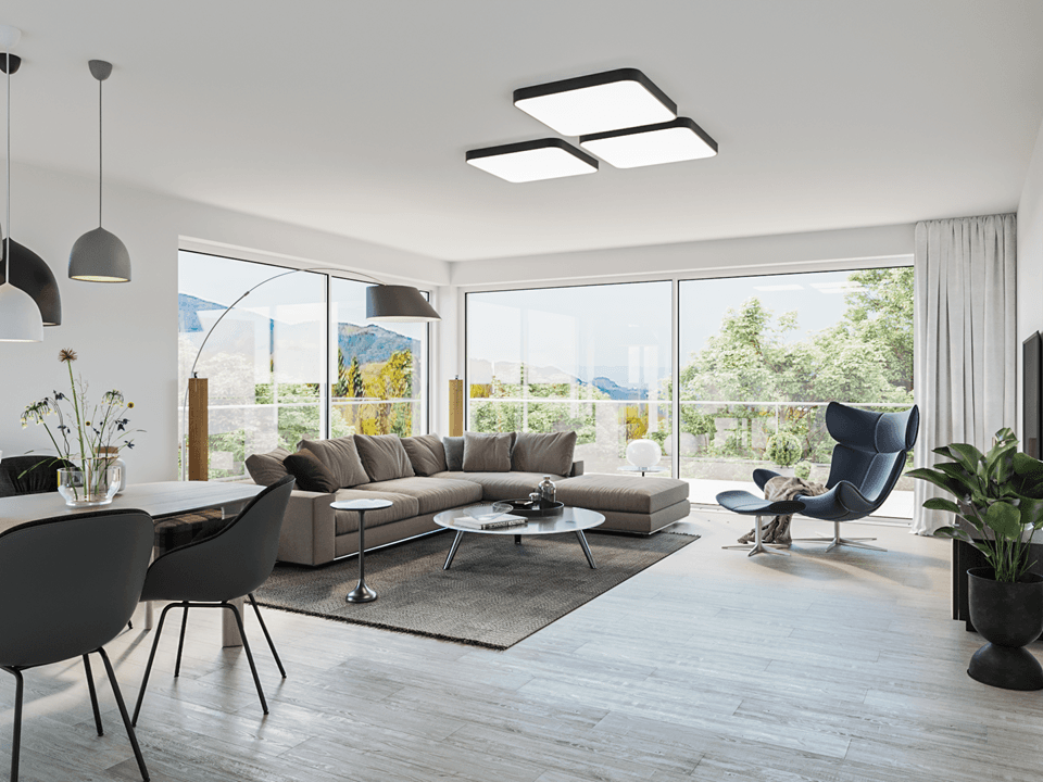 Heller, offener Wohn-Essbereich mit großen Fenstern, modernem Interieur und weitem Bergblick.