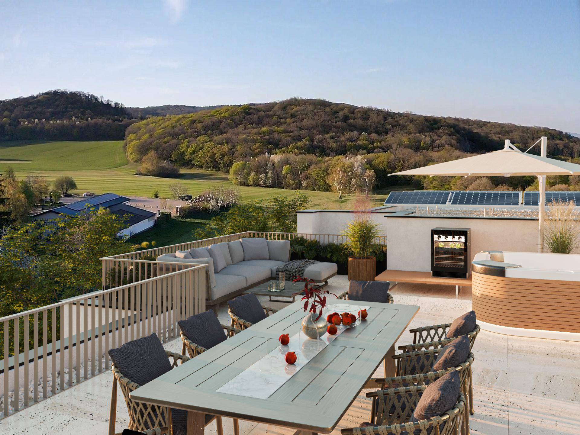 Geräumige Dachterrasse mit Essbereich, Lounge-Möbeln und weitem Blick über die grüne Landschaft.