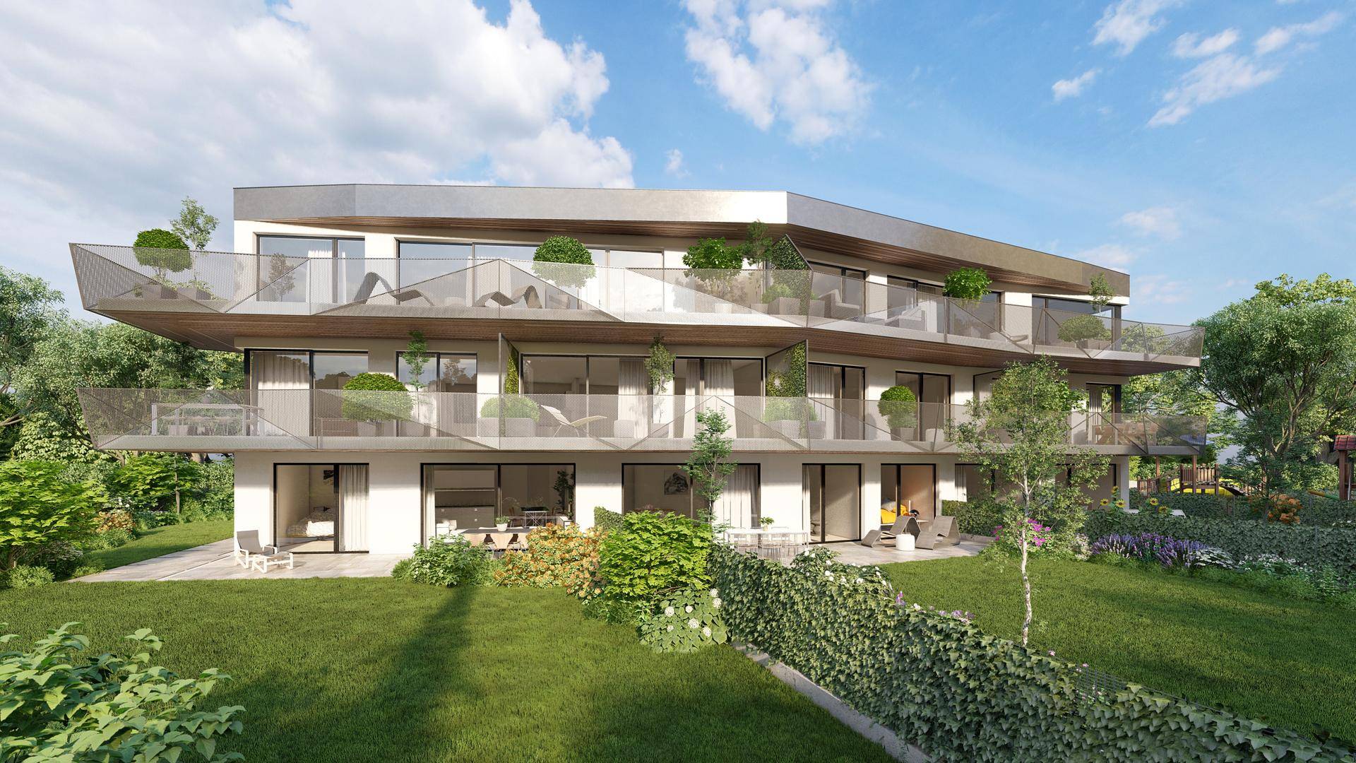 Neubau-Wohnanlage mit weitläufigen Grünflächen, Terrassen und Balkonen in ruhiger Umgebung.