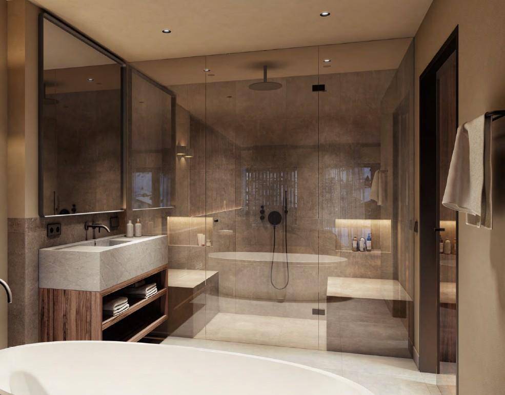 Luxuriöses Badezimmer mit freistehender Badewanne, großer Glasdusche und modernen Armaturen, sehr stilvoll.