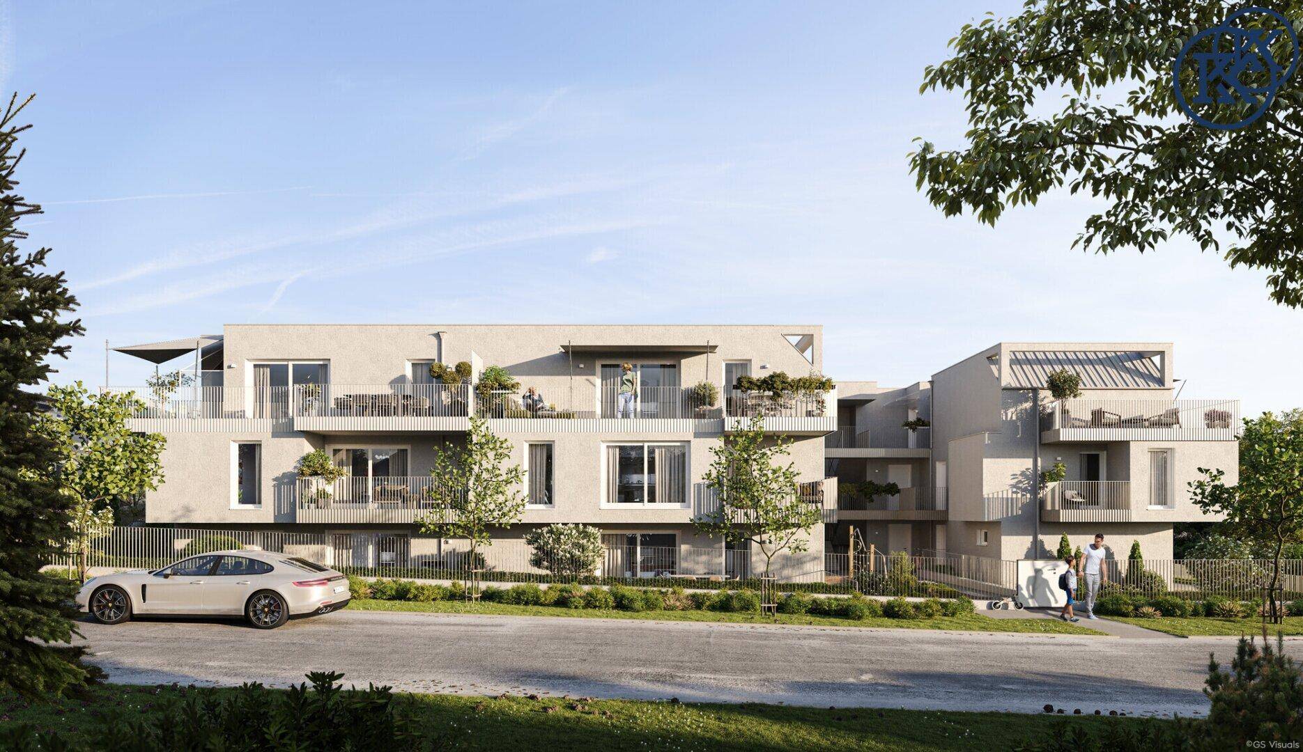 Ansicht der modernen Wohnanlage mit klarer Architektur, Balkonen und gepflegter Außenanlage.