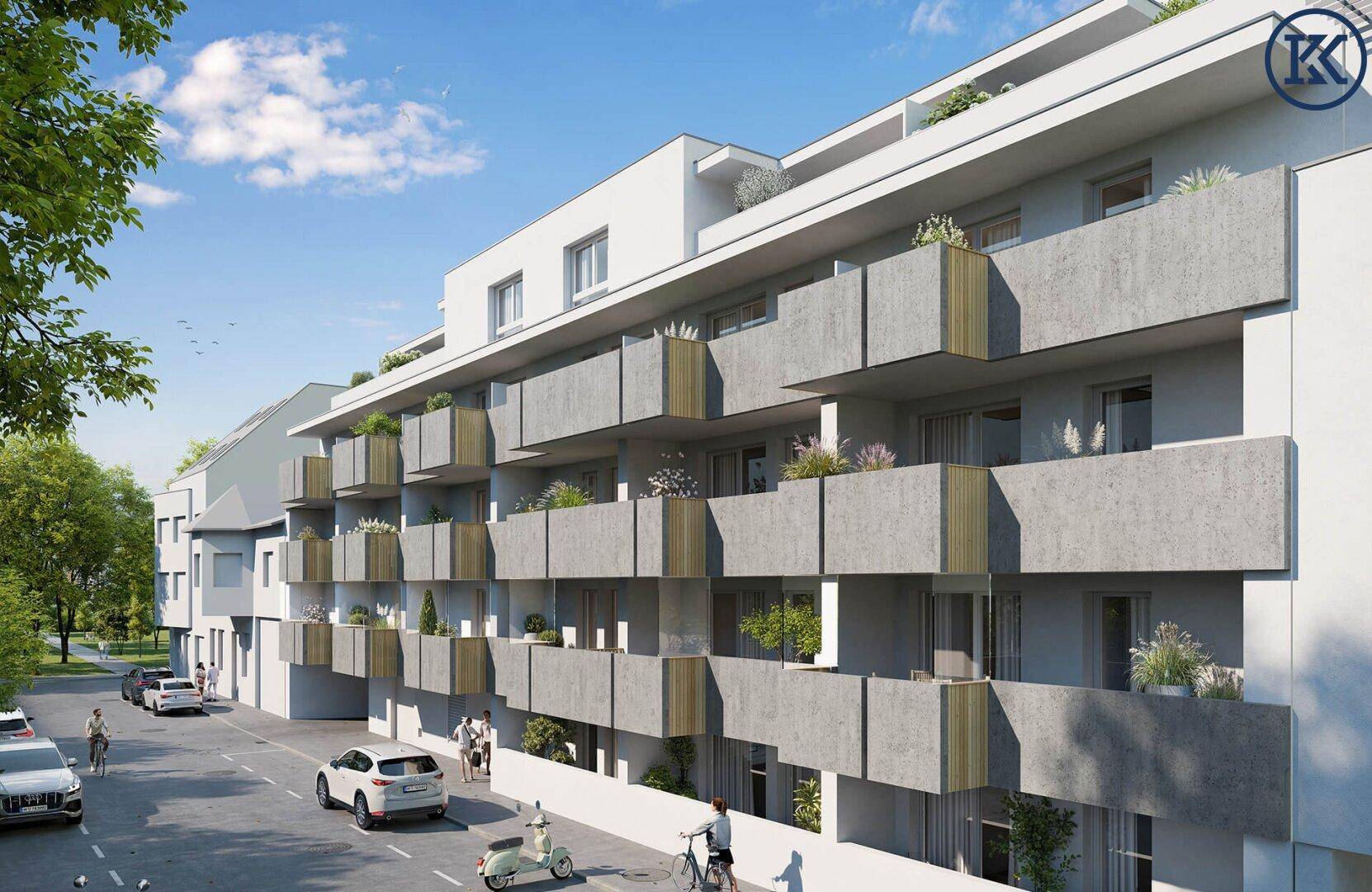 Moderne Wohnfassade mit zahlreichen Balkonen und einer ruhigen Straße im Vordergrund.