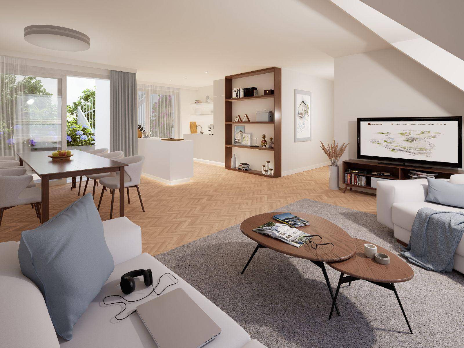Heller, offener Wohn-Essbereich mit integrierter Küche, Holzboden und Zugang zu einem Balkon.