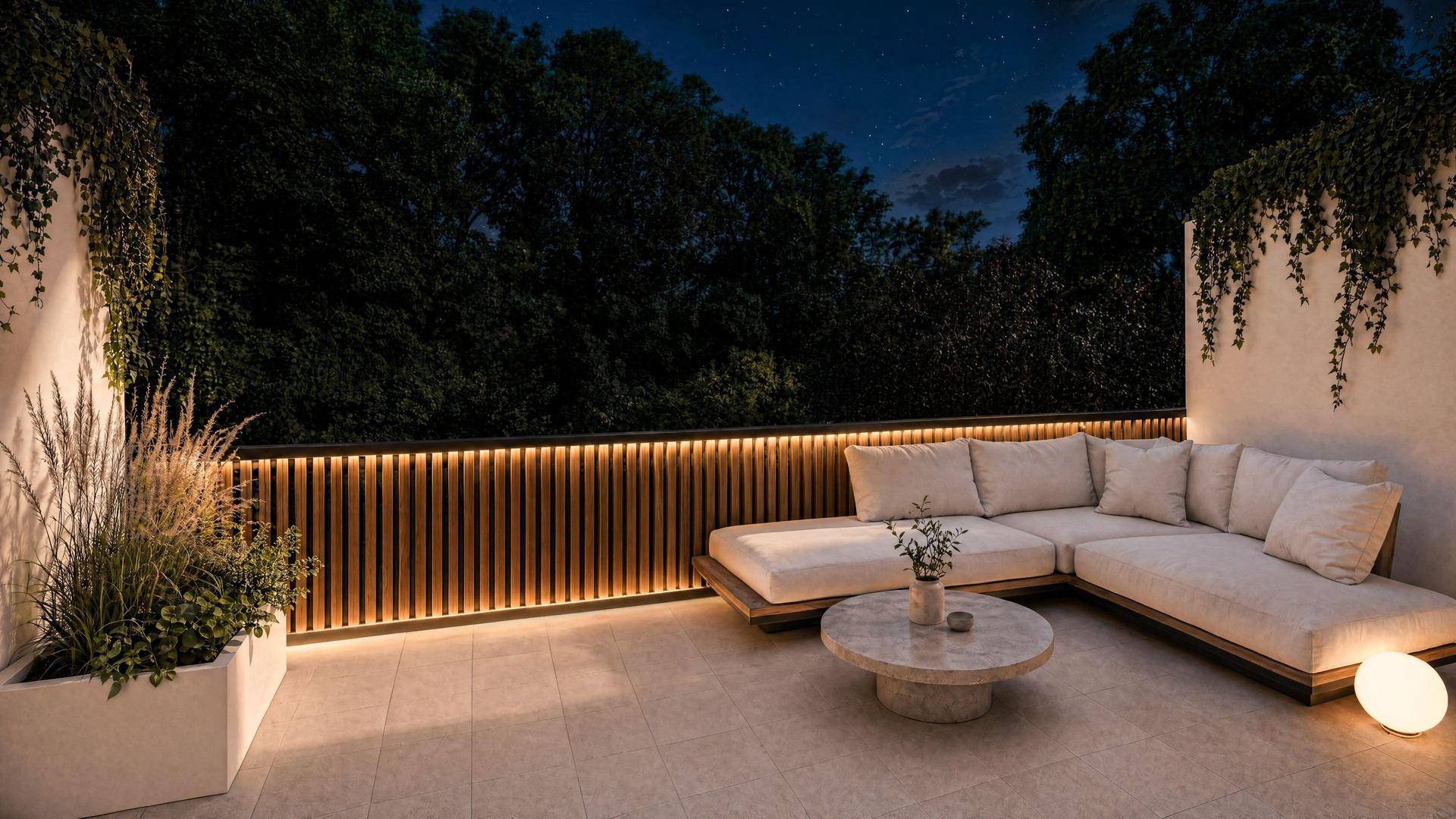 Beleuchtete Terrasse bei Nacht mit gemütlichen Loungemöbeln und stimmungsvoller indirekter Beleuchtung.