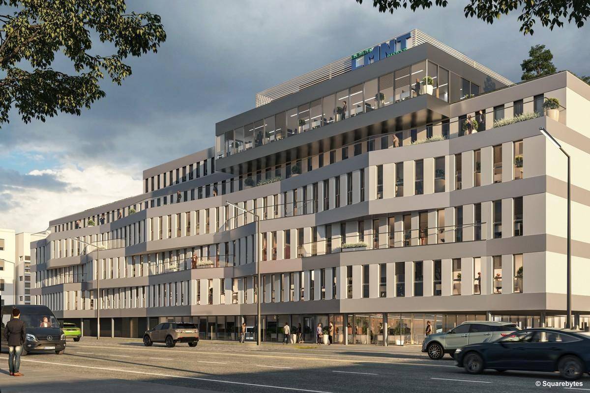 Ansicht des modernen Bürogebäudes von der Straße, mit gestuften Fassaden und großen Fenstern.