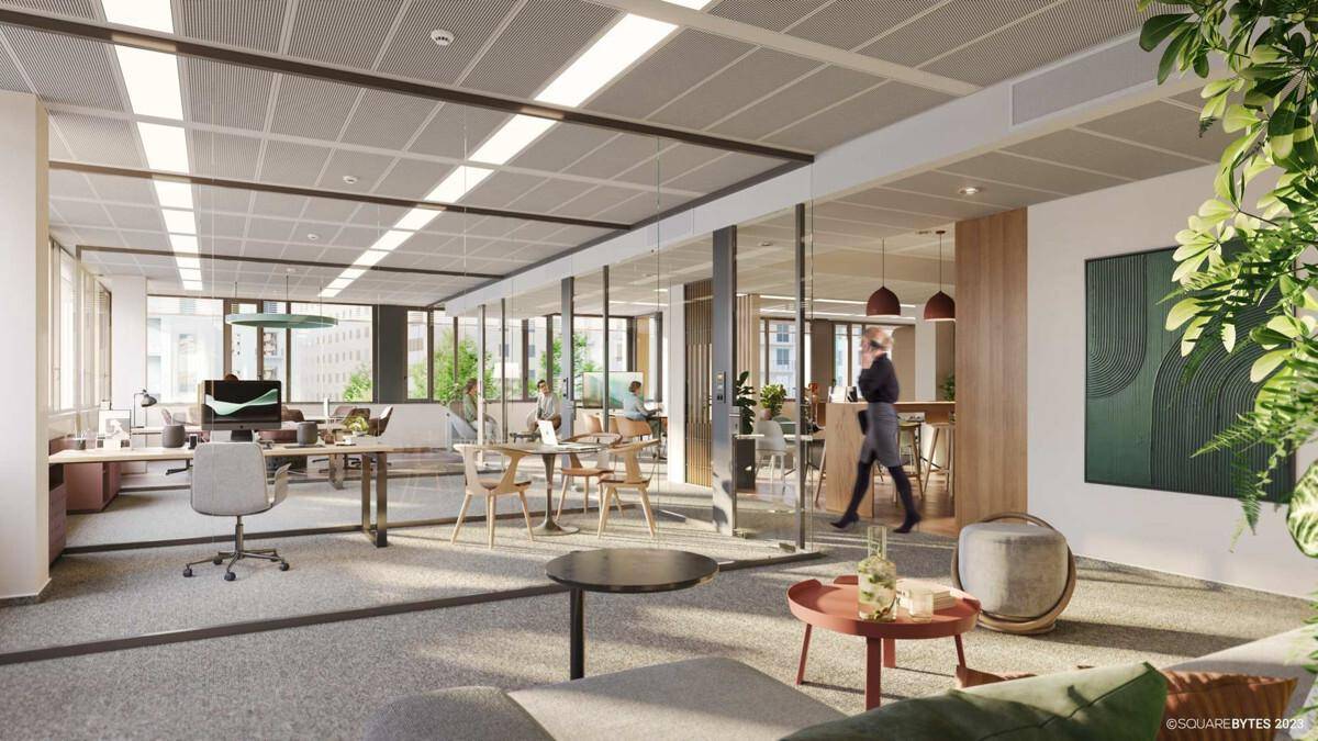 Gemütlicher Loungebereich in einem modernen Büro mit bequemen Sitzgelegenheiten und Pflanzen für Entspannung.
