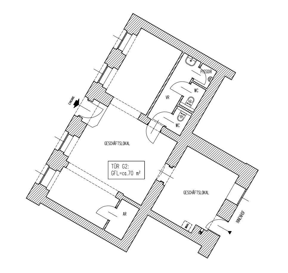 Grundriss eines Geschäftslokals mit zwei separaten Bereichen und Toiletten.