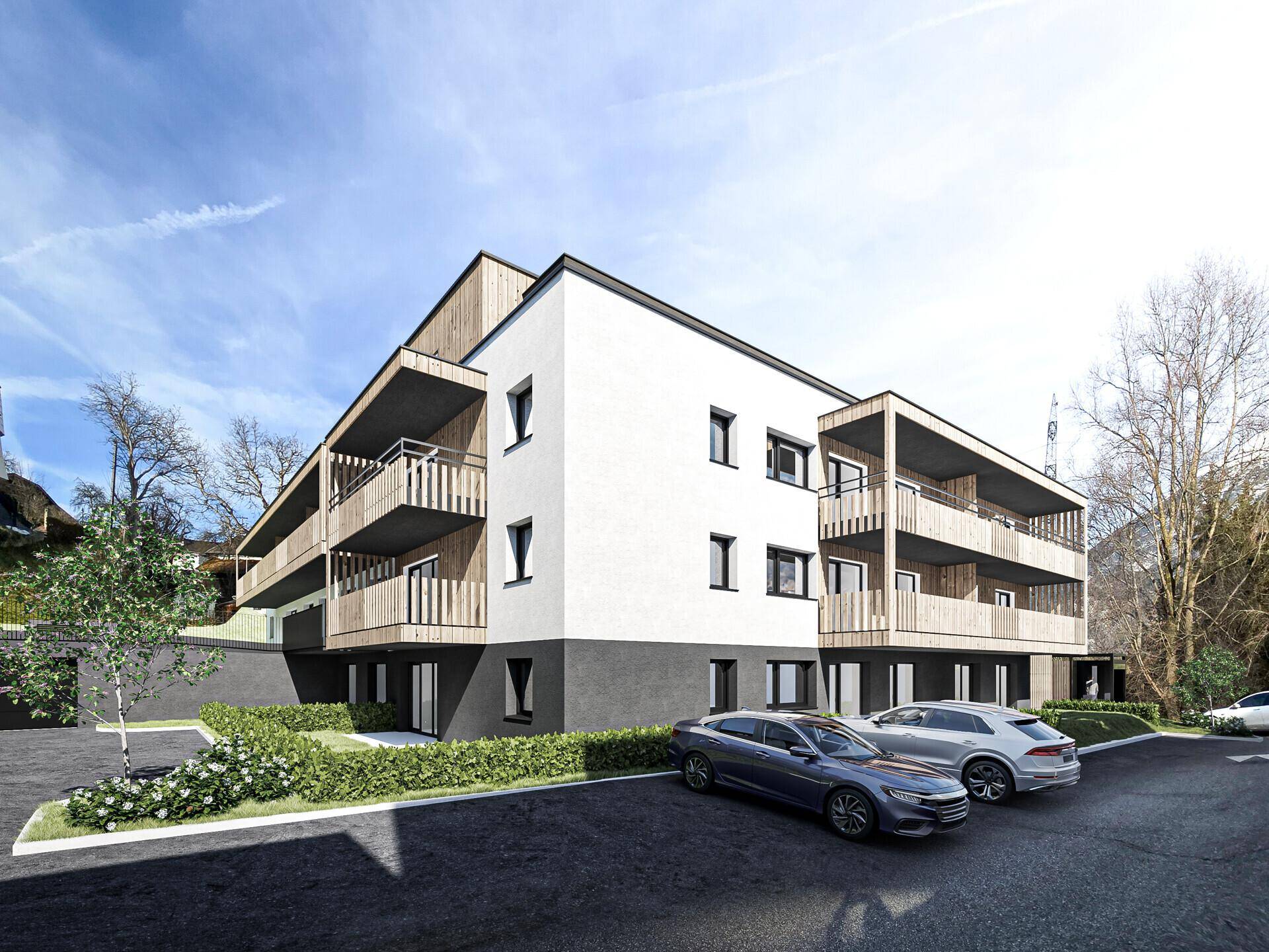 Ansicht des modernen Apartmentgebäudes mit Holzverkleidung und Parkplätzen.