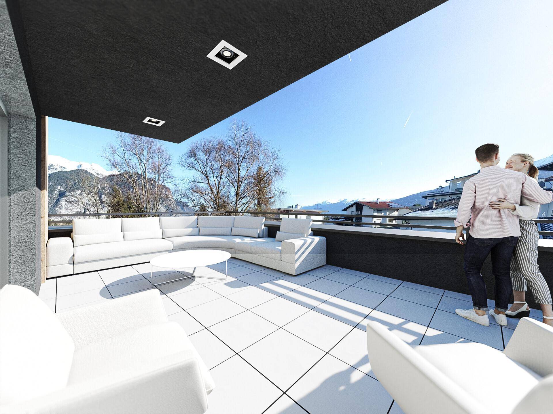 Geräumige Dachterrasse mit Lounge-Möbeln und weitem Blick auf die Berge.