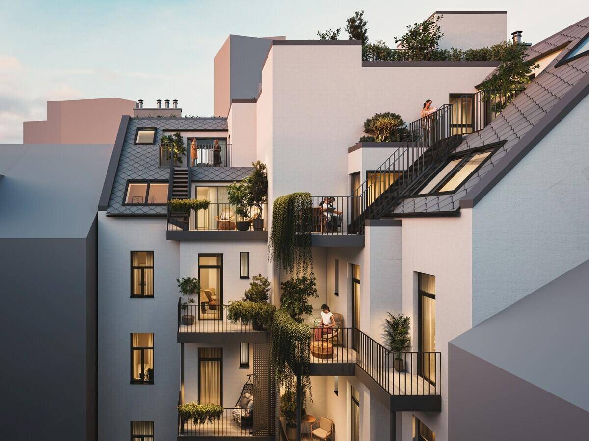 Moderne Balkone und Terrassen mit üppiger Bepflanzung an der Gebäudeseite, die eine grüne Oase schaffen.