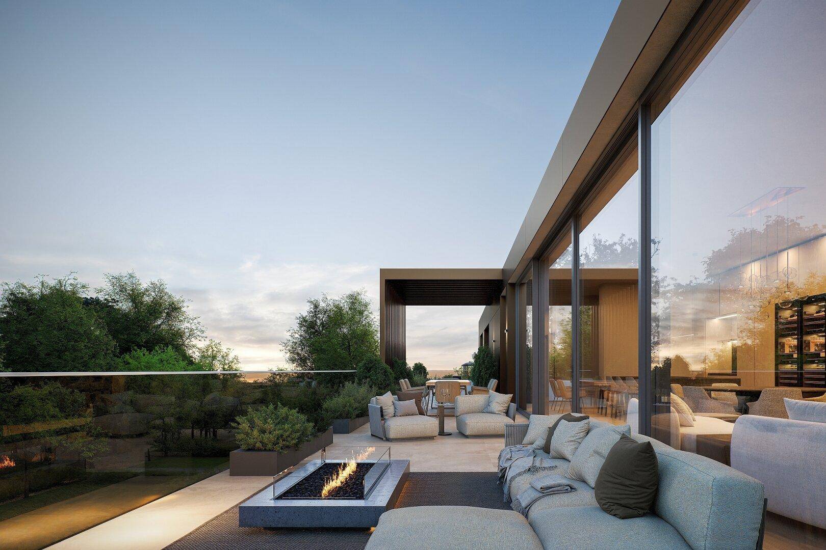 Exklusive Dachterrasse mit bequemen Lounge-Möbeln, Feuerstelle und weitem Blick ins Grüne.
