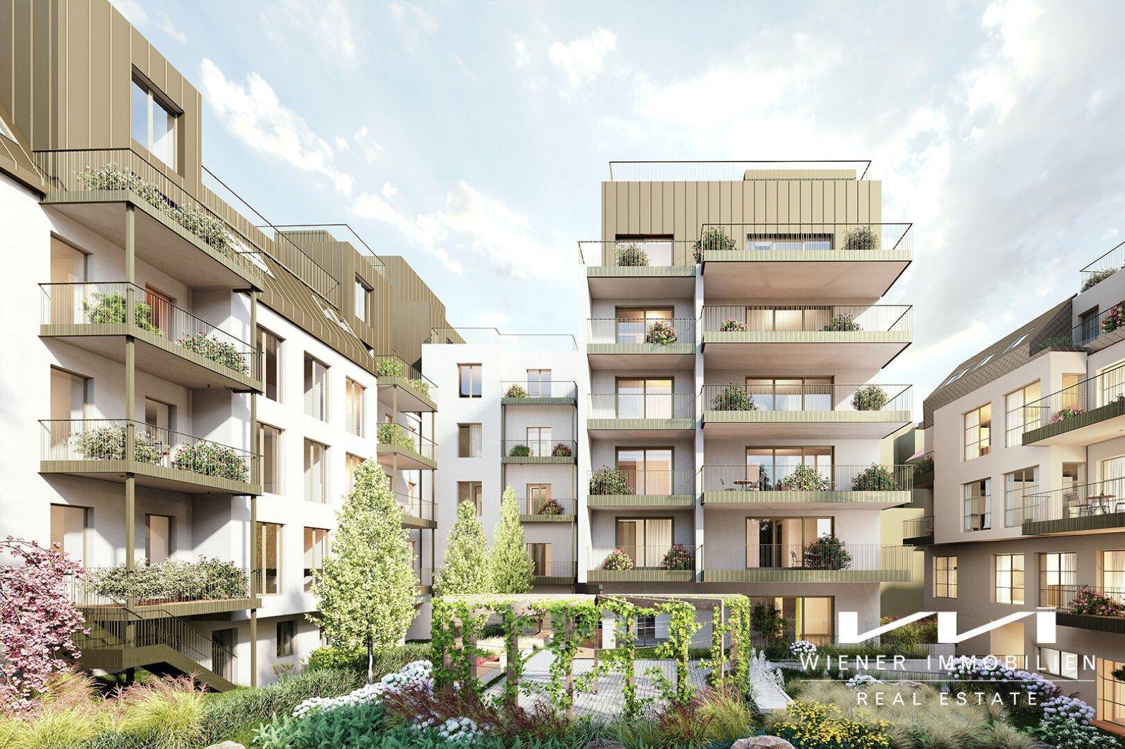 Moderne Wohnanlage mit mehreren Balkonen, begrünten Fassaden und einem gemeinschaftlichen Innenhof.