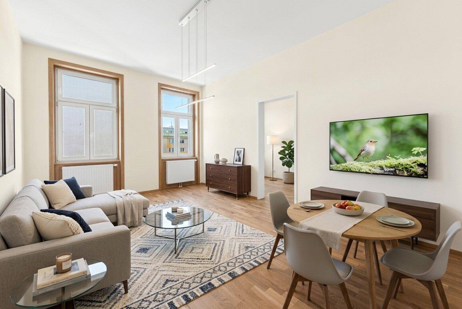 Heller Wohn- und Essbereich mit modernem Design, Holzboden und großen Fenstern, ideal für geselliges Beisammensein.
