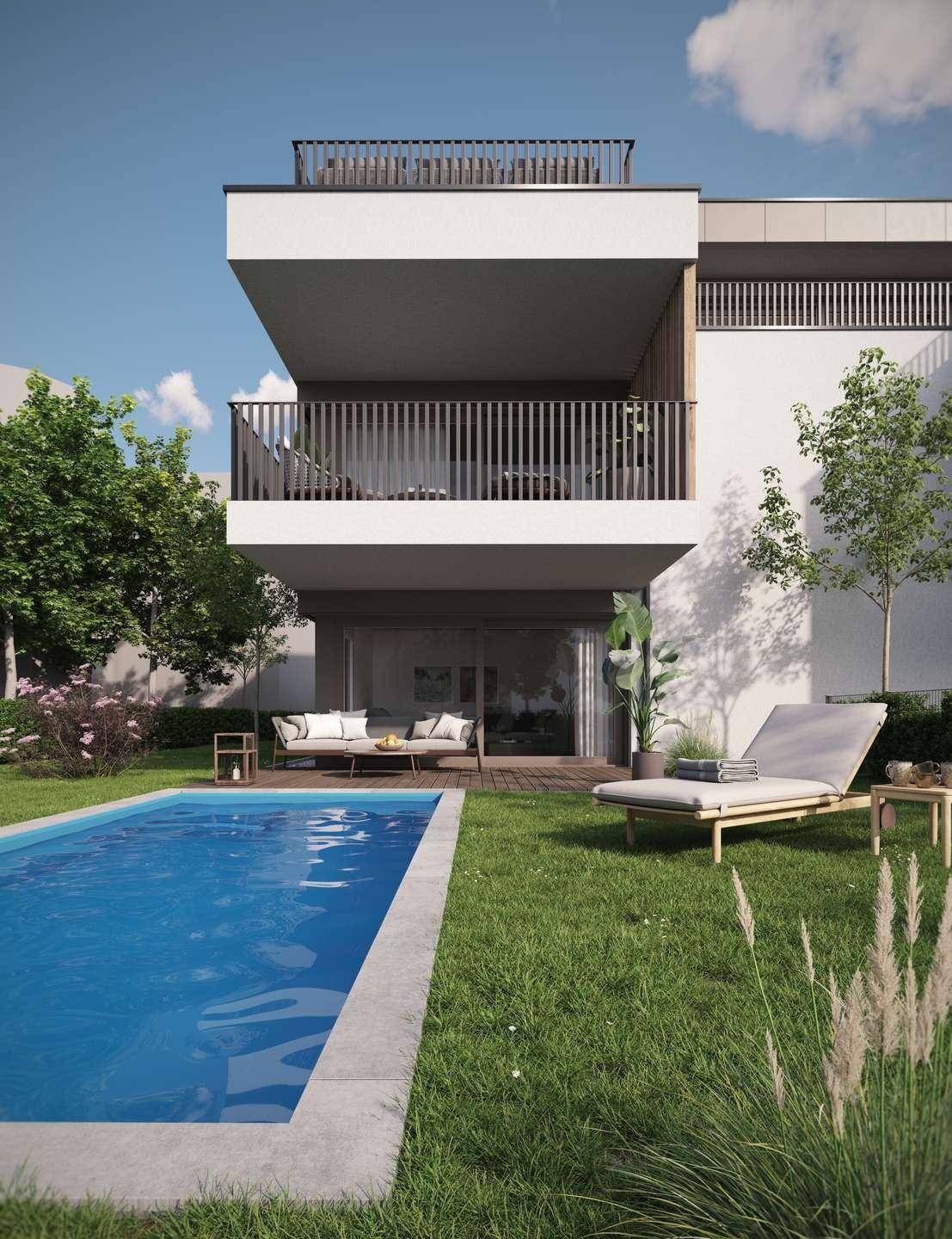Ansicht des modernen Gebäudes mit Swimmingpool und Liegewiese im gepflegten Gartenbereich.