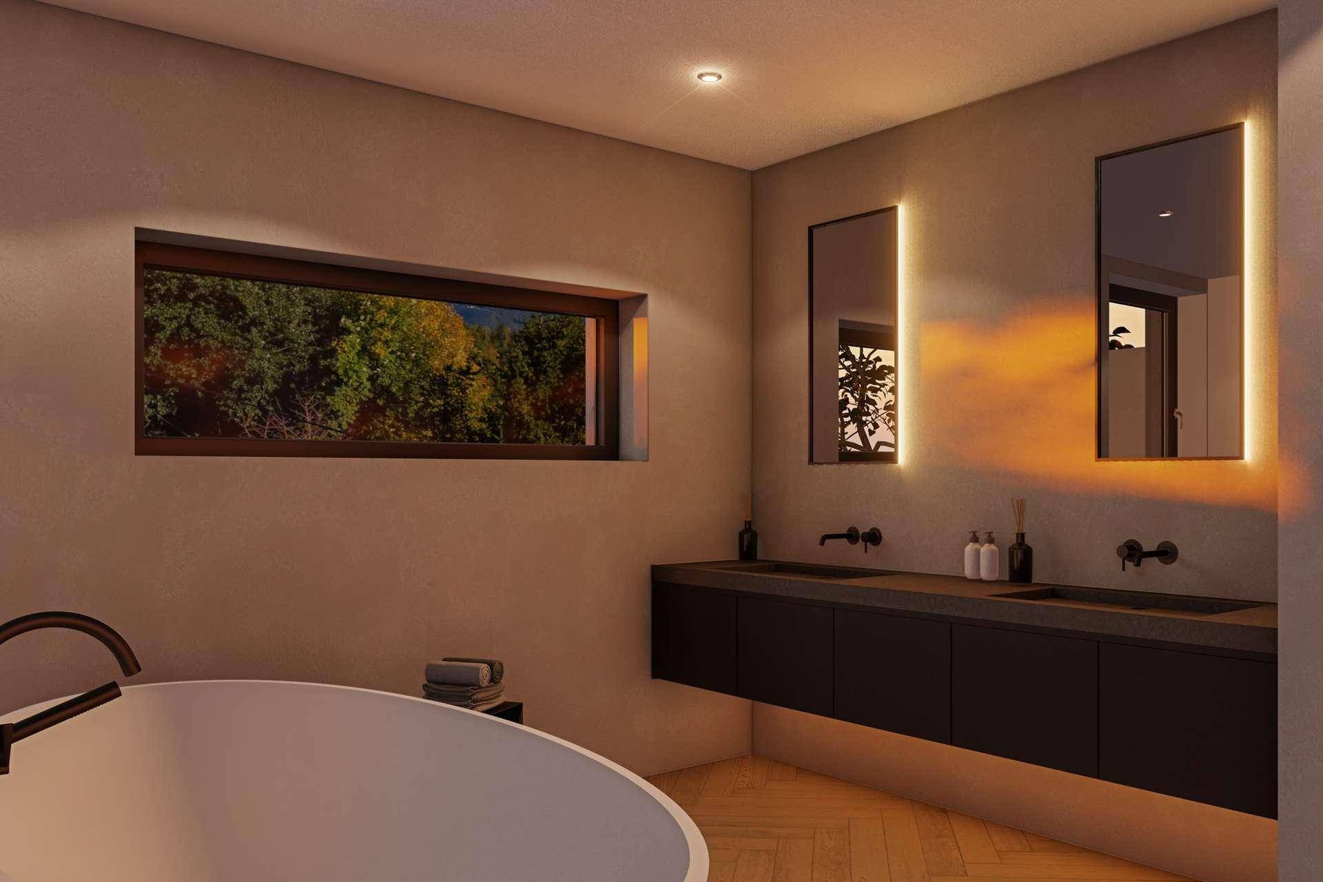 Modernes Badezimmer mit freistehender Badewanne, Doppelwaschbecken und Fenster mit Waldblick.