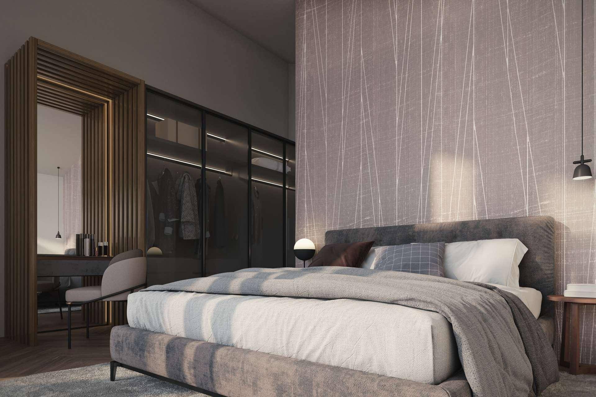Elegantes Schlafzimmer mit komfortablem Bett, integrierten Kleiderschränken und Schminktisch.