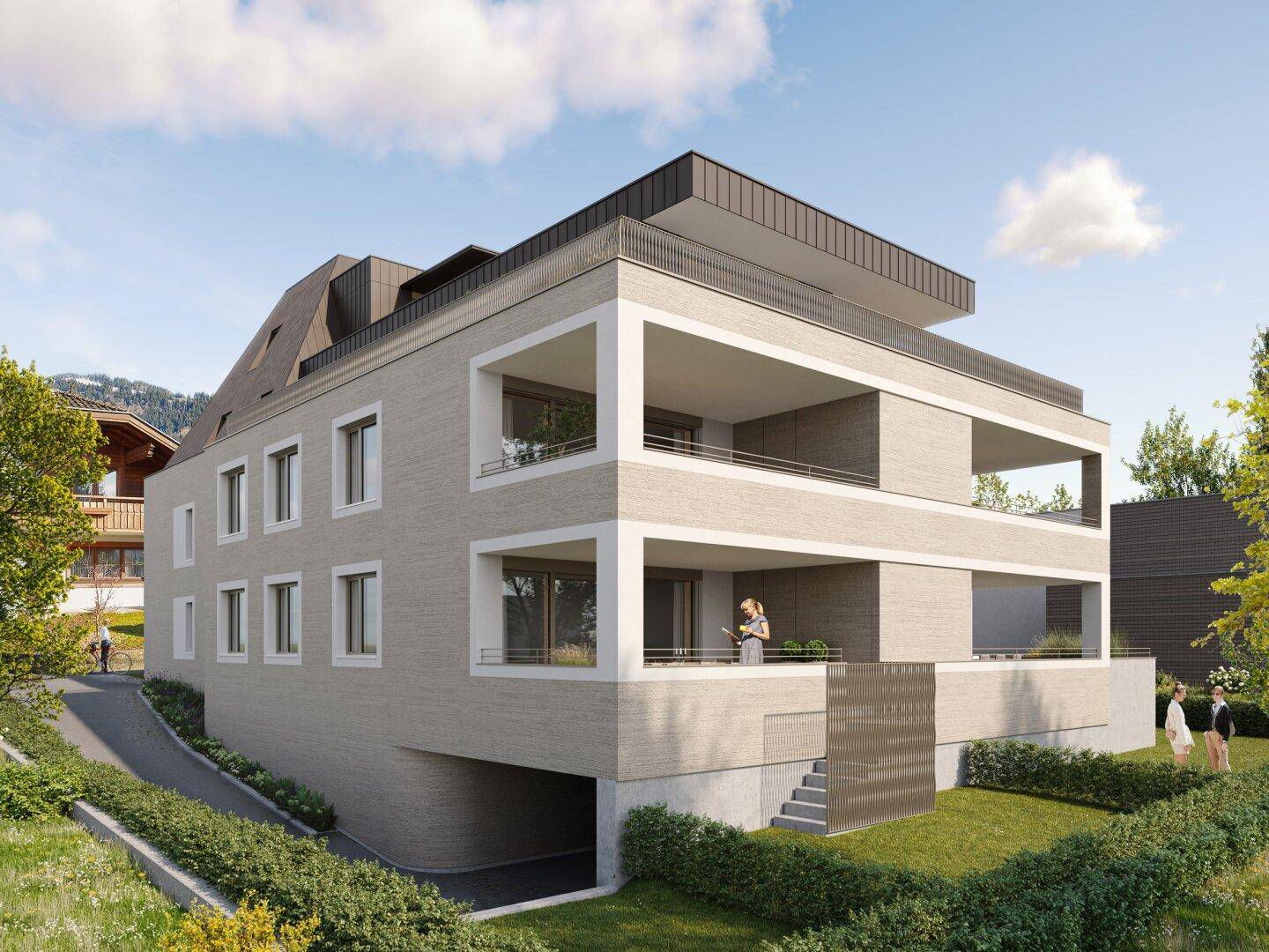 Ansicht des modernen Gebäudes mit Balkonen, Tiefgaragenzufahrt und umgebender Bepflanzung.
