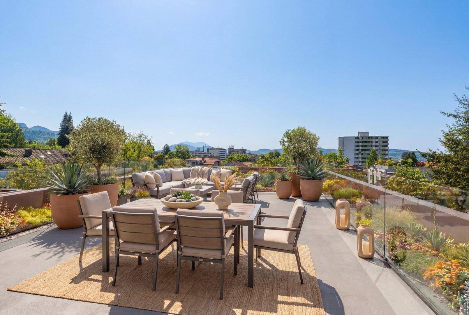 Großzügige Dachterrasse mit bequemen Gartenmöbeln und weitem Stadtblick.
