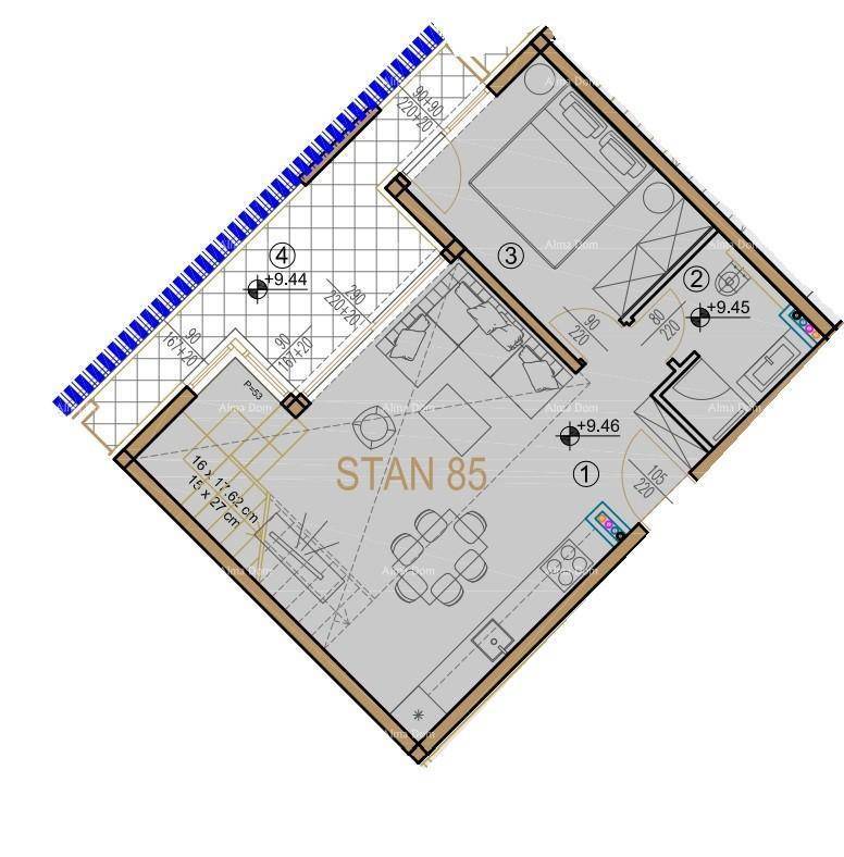 Grundriss der Wohnung STAN 85 mit offenem Wohnbereich, Schlafzimmer und großem Balkon.