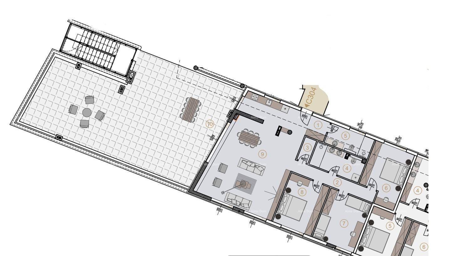 Grundriss einer Wohnung mit großem Wohnbereich, drei Schlafzimmern und Terrasse.