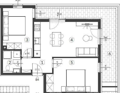 Grundriss einer Wohnung mit zwei Schlafzimmern, offenem Wohnbereich und großer Terrasse.