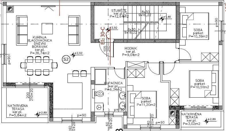 Grundrissplan einer Wohnung mit offenem Wohn-Essbereich, drei Schlafzimmern und zwei Terrassen.