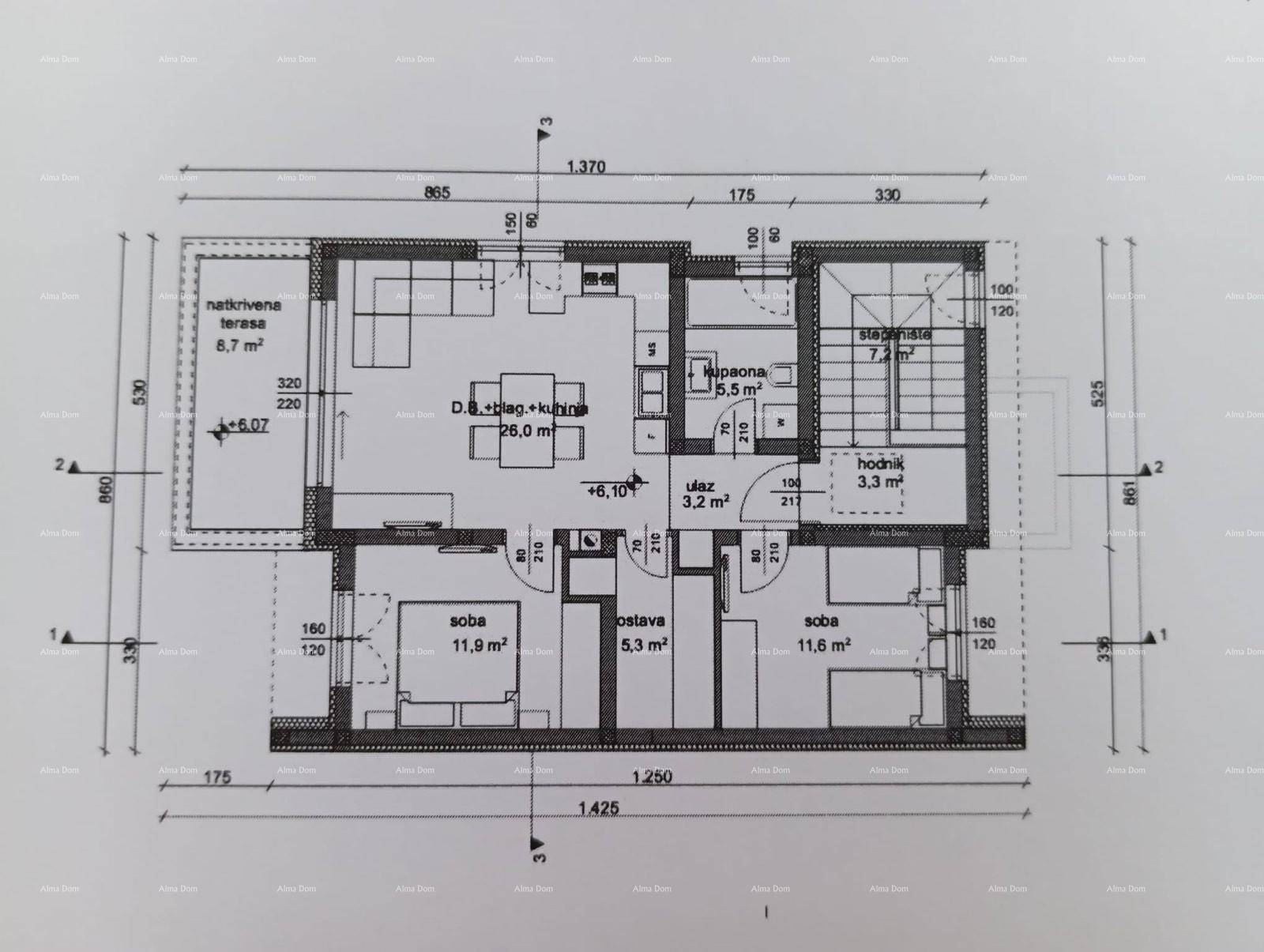 Detaillierter Grundriss einer Wohneinheit mit offener Küche, Wohnbereich, zwei Schlafzimmern und Terrasse.
