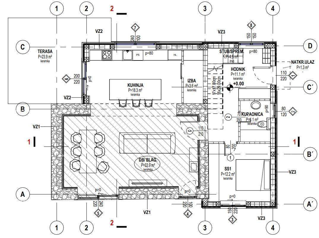 Grundriss des Erdgeschosses mit offener Küche, Wohn-Essbereich, Schlafzimmer und Terrasse.