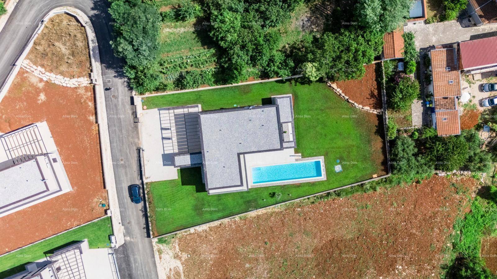 Vogelperspektive der modernen Villa mit Pool, Garten und Zufahrt in ländlicher Umgebung.