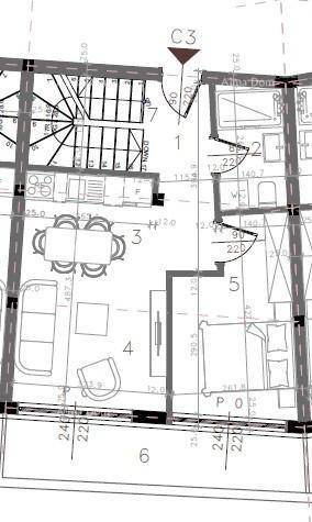 Grundriss des Erdgeschosses mit offenem Wohnbereich, Küche, Schlafzimmer und Terrasse.