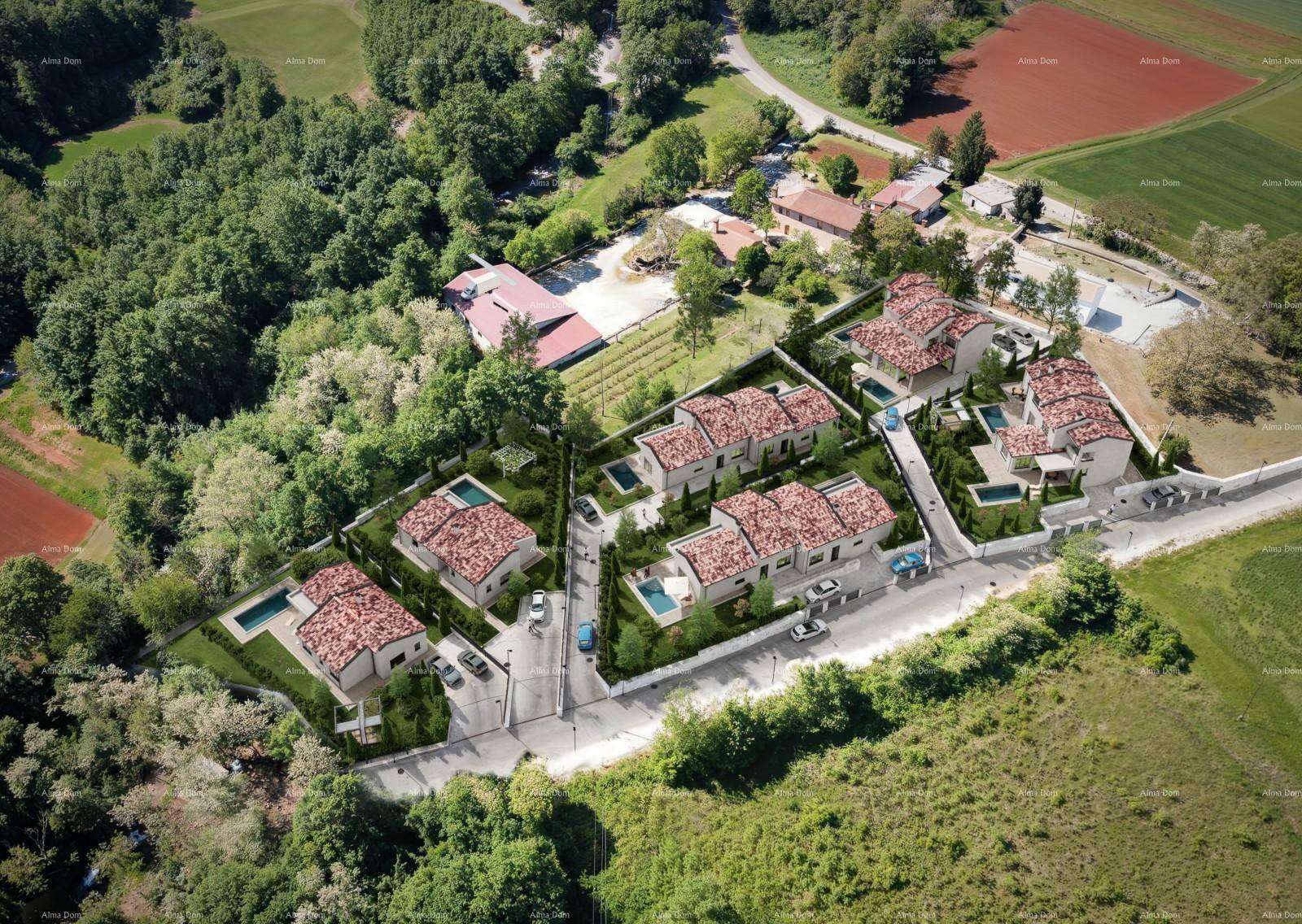 Übersicht der Wohnsiedlung aus der Vogelperspektive, umgeben von viel Grün und mit privaten Pools.