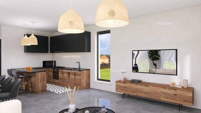 Moderne Küche mit Holzelementen und schwarzer Arbeitsplatte, offen zum Wohnbereich.