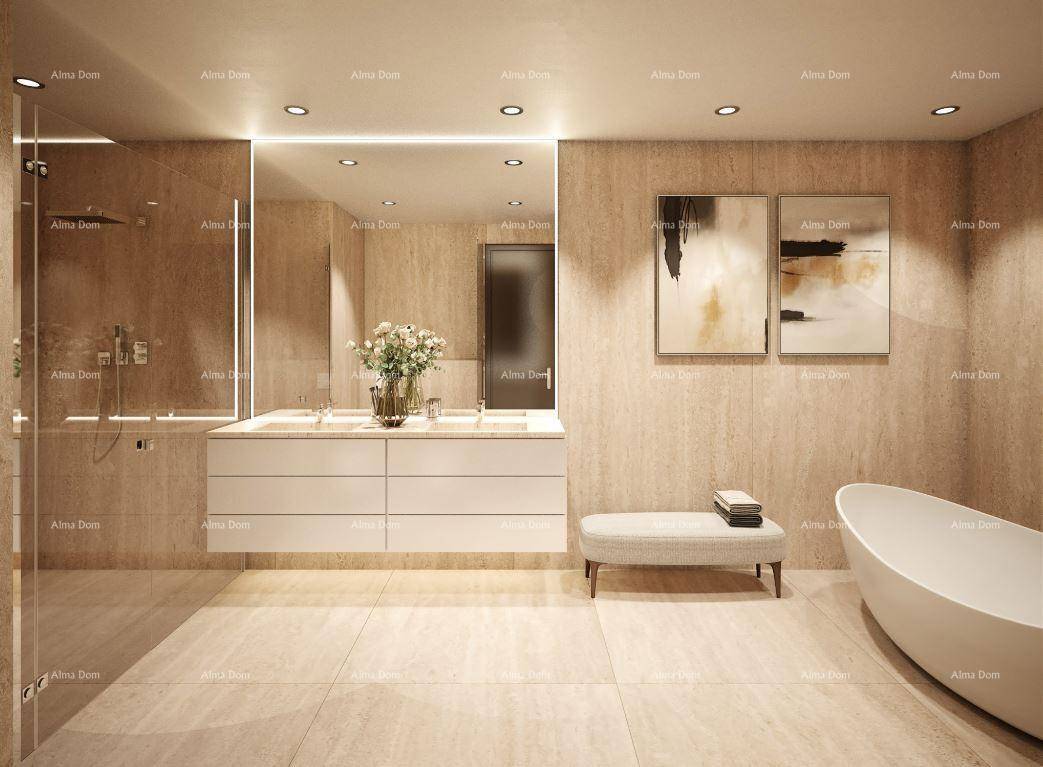 Luxuriöses Badezimmer mit freistehender Badewanne, Doppelwaschbecken und großformatigen Fliesen.