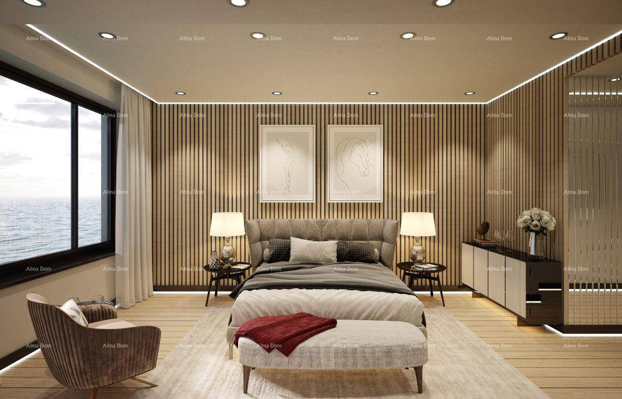 Elegantes Schlafzimmer mit Doppelbett, Meerblick und bequemer Sitzbank am Fußende.