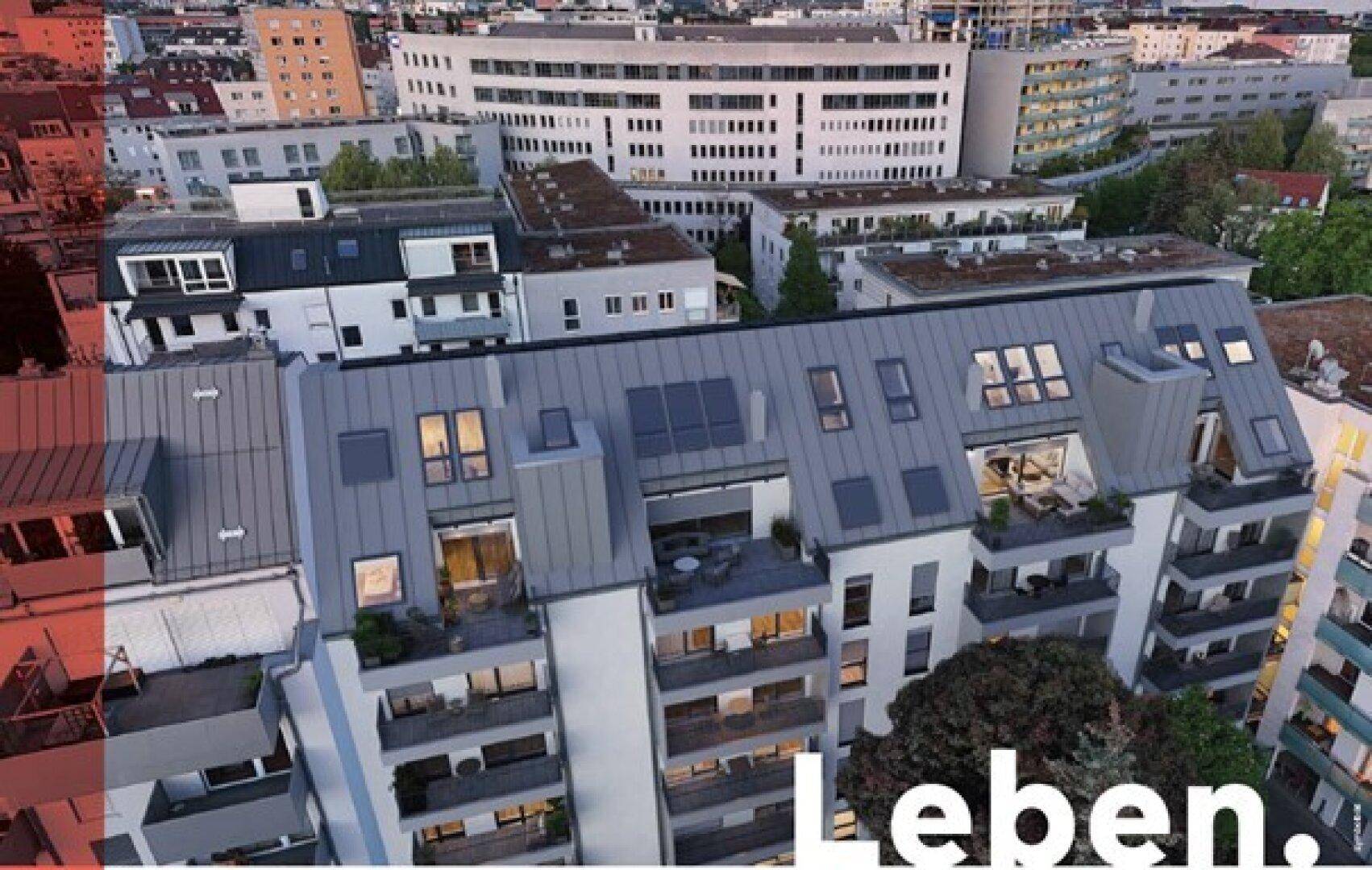 Luftaufnahme eines modernen Wohnkomplexes mit mehreren Balkonen und Dachterrassen in städtischer Umgebung.