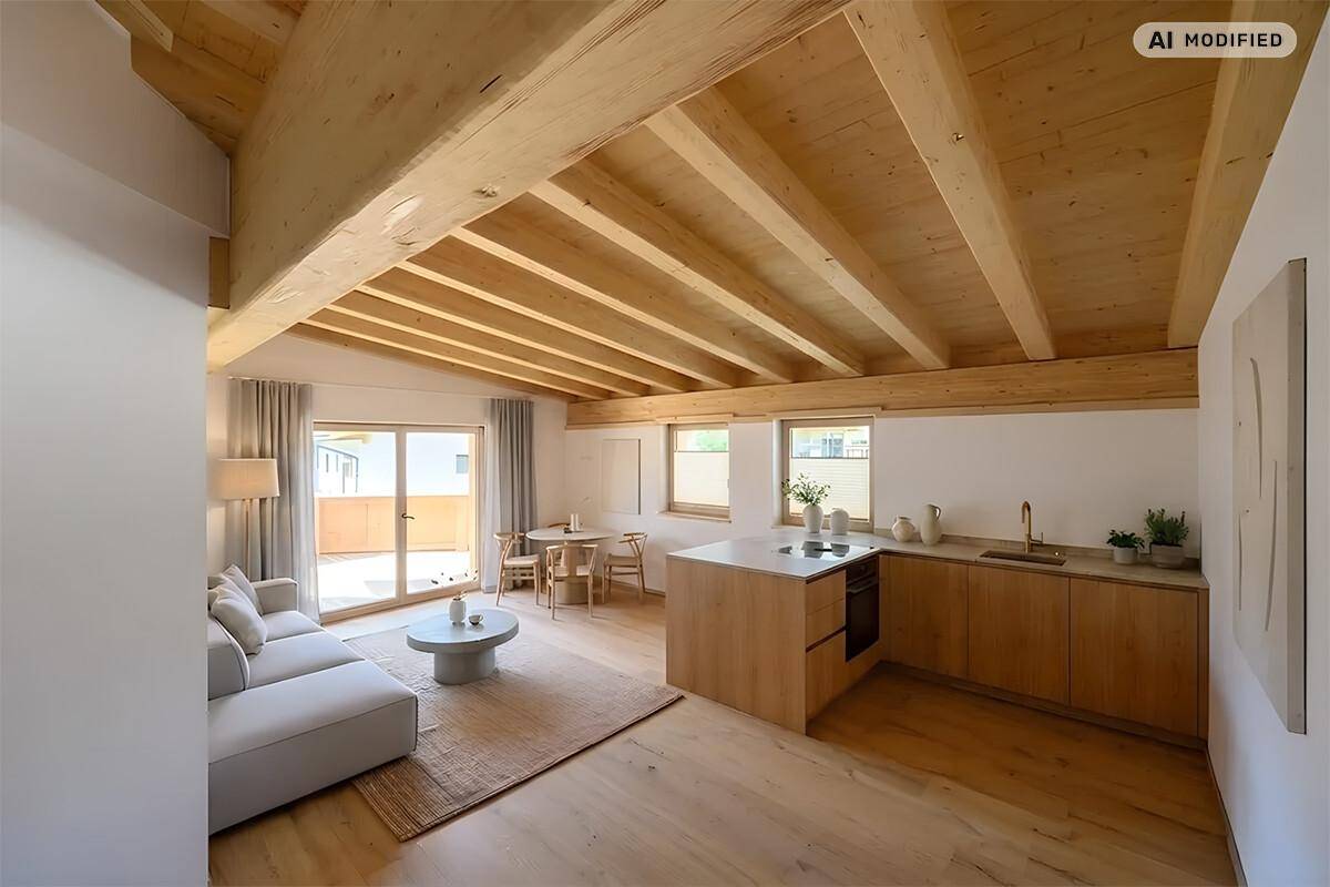 Offener Wohn-Essbereich mit moderner Küche, Holzboden und Zugang zum Balkon.