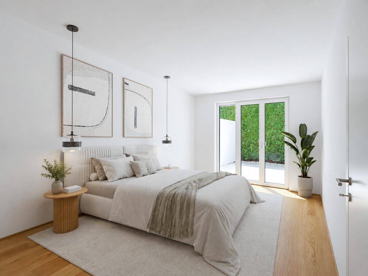 Modernes Schlafzimmer mit Holzboden, großem Bett und direktem Zugang zum Außenbereich.