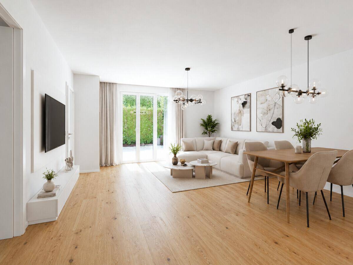 Helles, offenes Wohn-Esszimmer mit Holzboden, moderner Einrichtung und Zugang zum Garten.