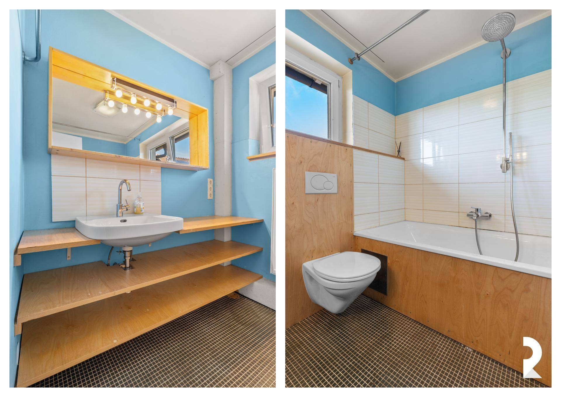 Modernes Badezimmer mit blauen Wänden, Badewanne und Einzelwaschbecken.