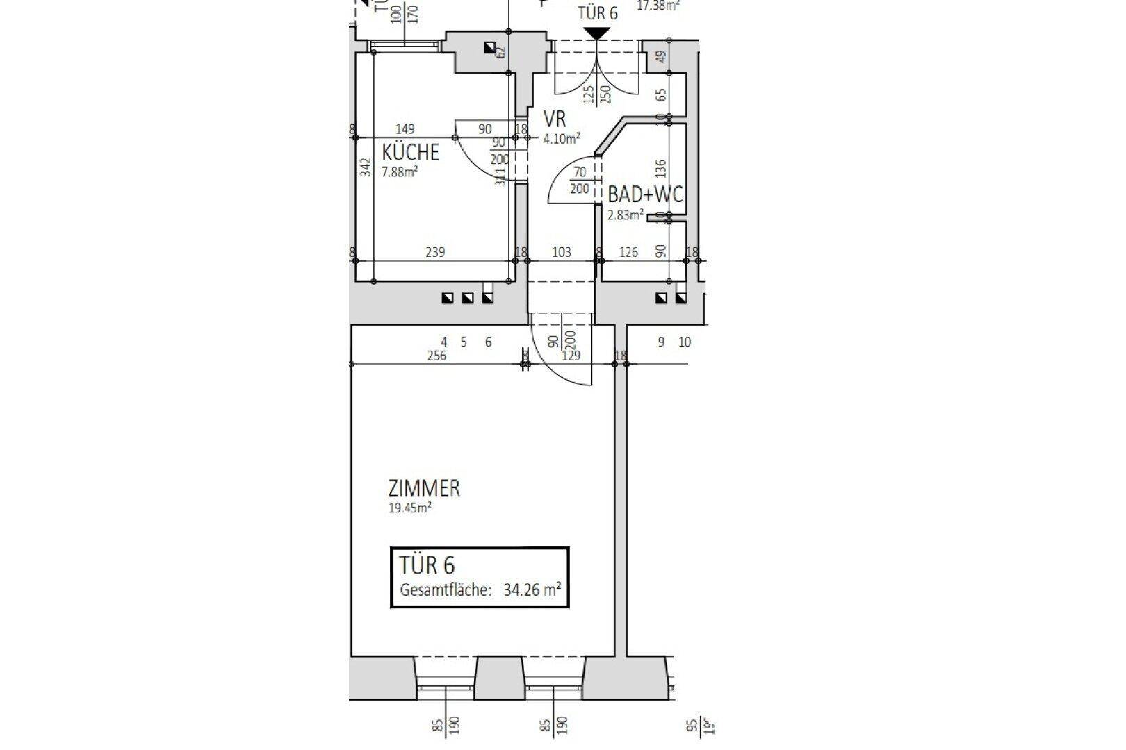 Grundriss einer Wohnung mit Zimmer, separater Küche und Bad mit WC.