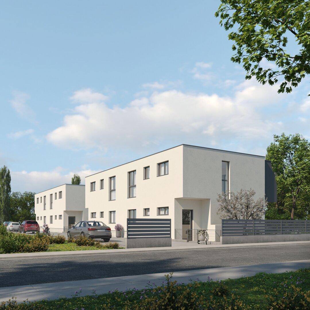 Vorderansicht der modernen Reihenhäuser mit Parkplätzen und minimalistischer Fassadengestaltung.