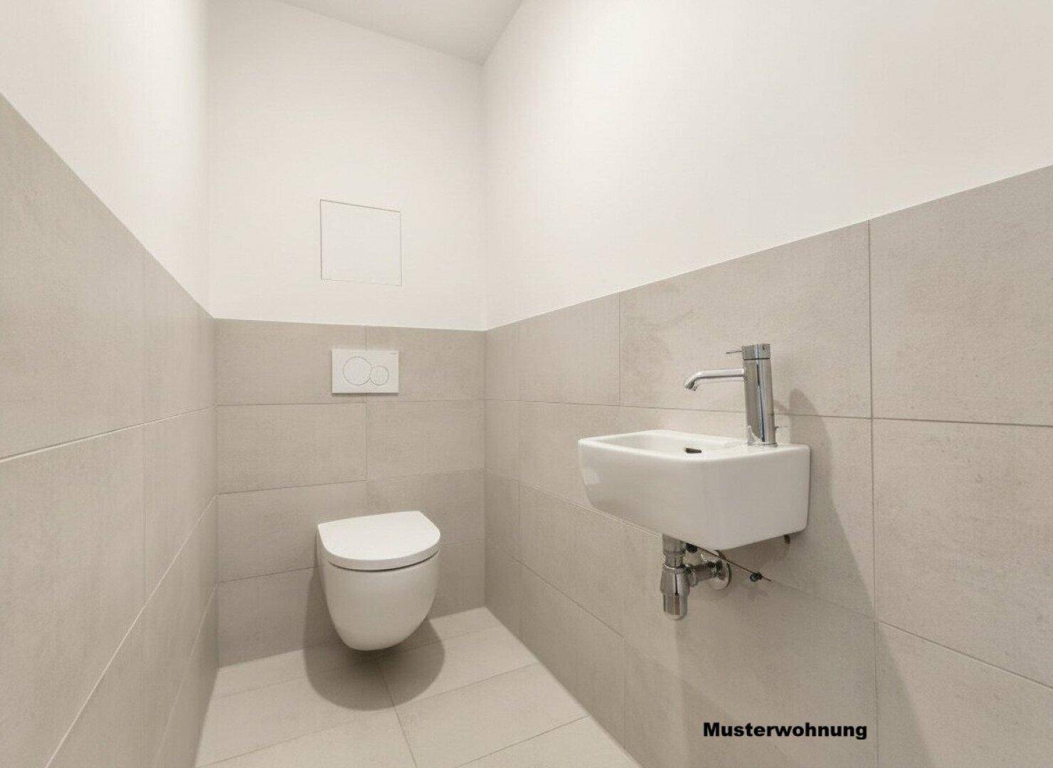 Separates Gäste-WC mit modernem Wand-WC und kleinem Waschbecken.