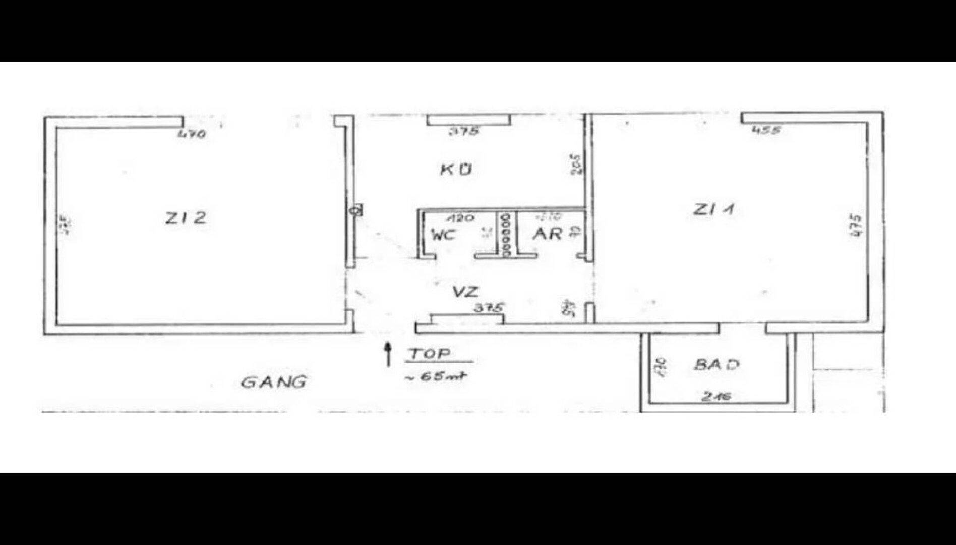 Einfacher Grundriss einer Wohnung mit zwei Zimmern, Küche, Bad und WC.